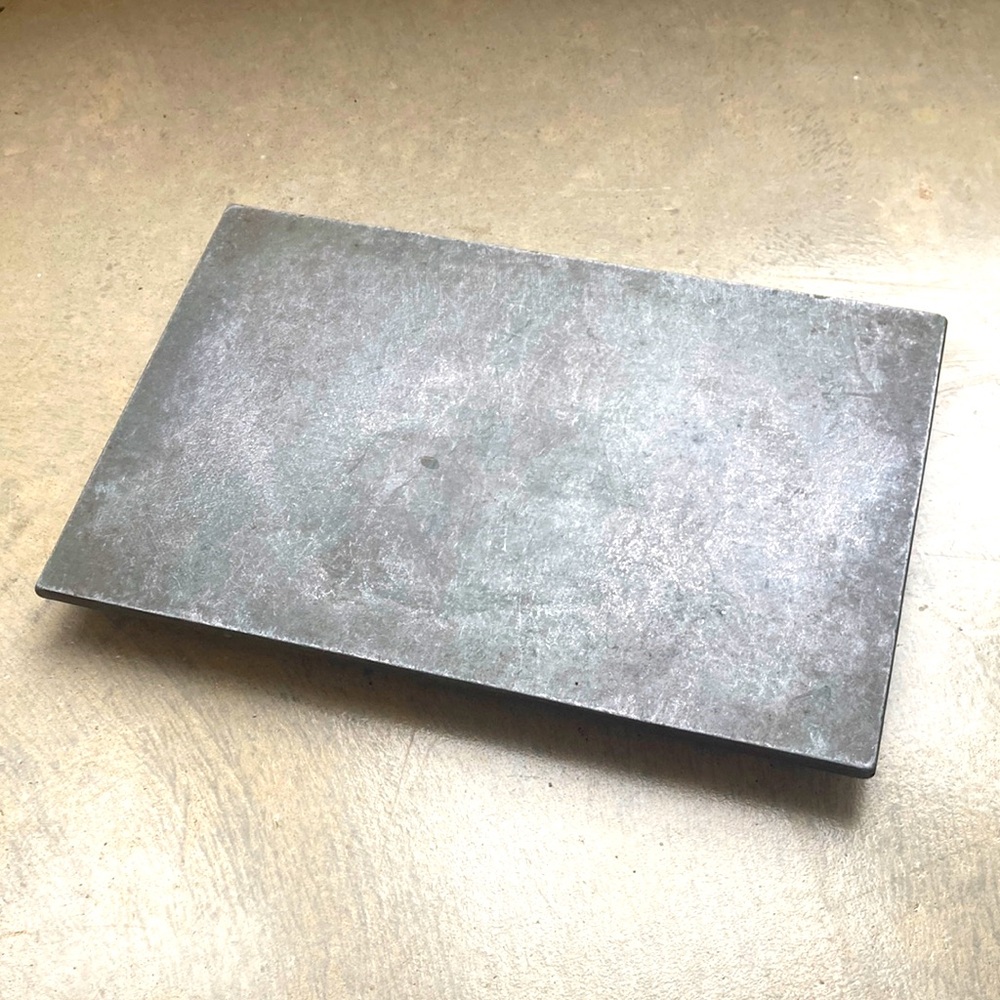 Condiment slate pedestal stand to use near cooktop. Keep olive oil salt dish etc